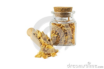 Crispy carmelized fried onion flakes in wooden scoop and glass jar on isolated on white background. Spices and food ingredients Stock Photo