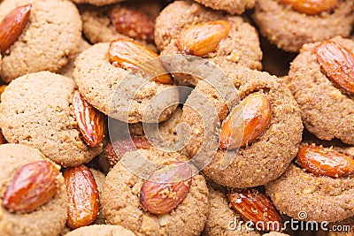 Crispy cookies with almond as a background close up. Selective focus Stock Photo