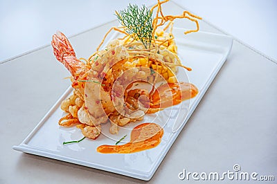Crispy deep fried tiger prawn with mango salsa and thousand island sauce Stock Photo