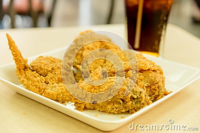 Crispy fried chicken with glass of cola closeup Stock Photo