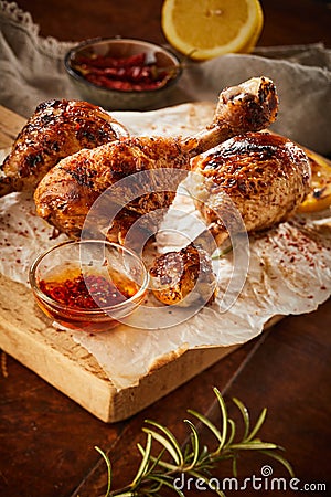 Crispy grilled seasoned chicken legs or drumsticks Stock Photo