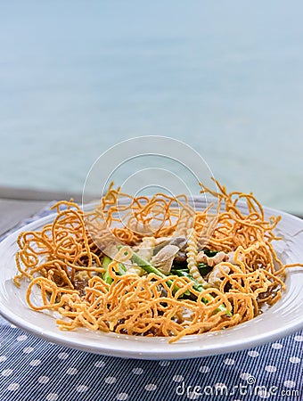 Crispy noodles in thick gravy Stock Photo