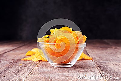 Crispy potato chips in a bowl. Tasty paprika chips Stock Photo