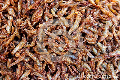 Crispy small fish placed on the stall for sale Stock Photo