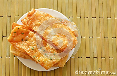 Crispy sweet Roti Indian food made of flour on dish Stock Photo