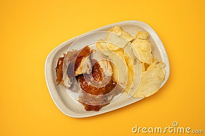 crispy tasty baked piglet and potato in ceramic dish Stock Photo