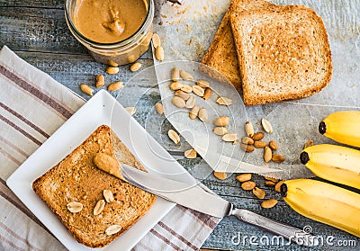 Crispy toast with peanut butter, bananas, breakfast, top view Stock Photo