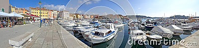 The Rovinj waterfront riva overlooking the colorful marina Stock Photo