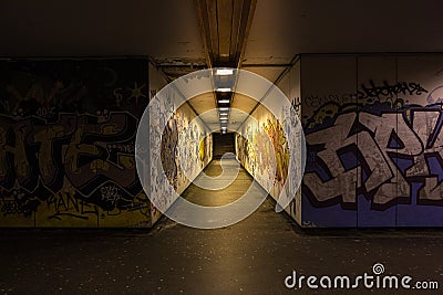 Croatia, Zagreb, June 21, the dark passage of a deserted, eerie creepy concrete indoor pathway grafted with graffiti at night Editorial Stock Photo