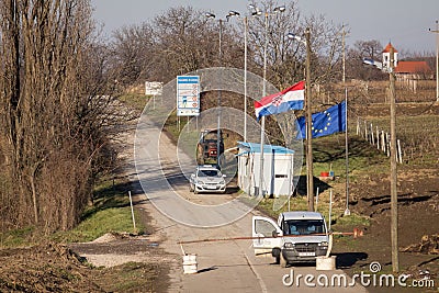 Croatian border police guarding the checkpoint of the border crossing of Bapska Berkasovo with Serbia, closed Editorial Stock Photo