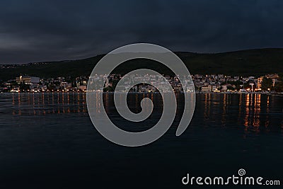 Croatian coast town Selce illuminated at dusk. Stock Photo