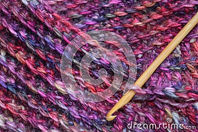 Crochet hook and fabric background Stock Photo