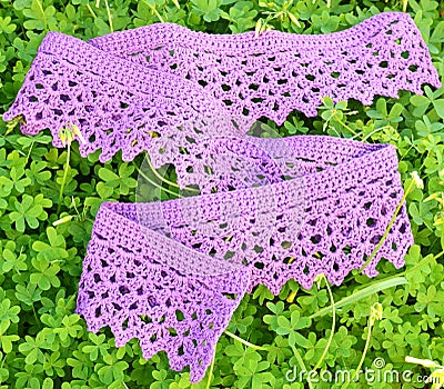 Crochet scarf on clover leaves Stock Photo