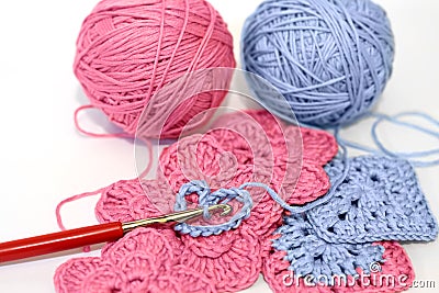 Crocheting project with pink and blue yarn Stock Photo