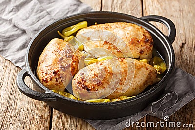 Crock Pot Mississippi Chicken is made with chicken breasts, au jus gravy, ranch seasoning, real butter and pepperoncini peppers Stock Photo
