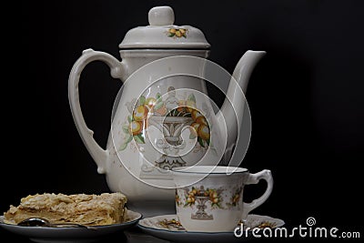 Crockery, cup and portion of Napoleon cake Stock Photo