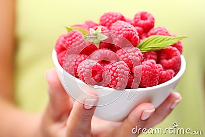 Crockery with raspberries Stock Photo