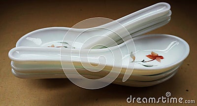 crockery spoon isolated on brown background Stock Photo