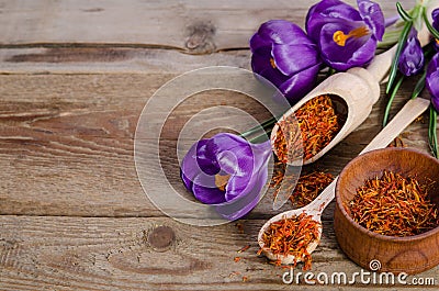Crocus flowers and spoon with saffron Stock Photo