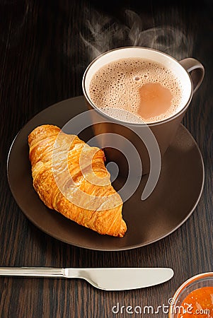 Croissant and apricot jam Stock Photo