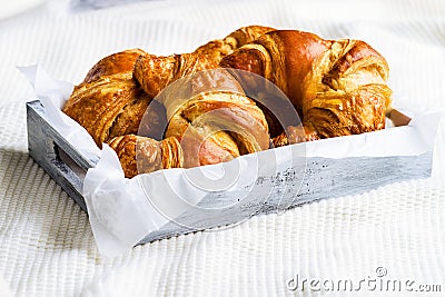 Croissant for breakfast on white woolen surface Stock Photo