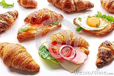 Croissant sandwich assortment. Various stuffed croissants on white Stock Photo