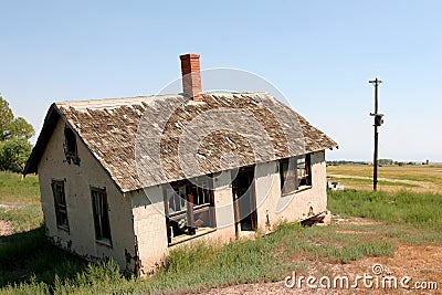Crooked and abandoned home Stock Photo