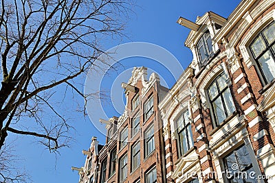 Crooked and colorful heritage buildings, located along Bloemgracht Canal in Jordaan Stock Photo