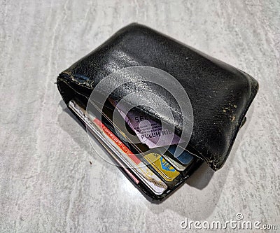 crooked or shabby men's wallet that is often tucked into the back pocket of the pants Stock Photo