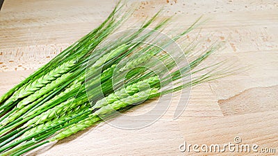 Crop barley on wooden background Stock Photo