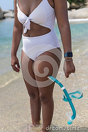 Crop Female Swimmer Carrying Snorkeling Gear Near Sea Stock Photo