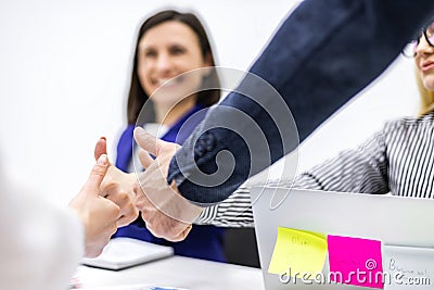 Crop of hands of businessmen close hands clasped closely. Stock Photo