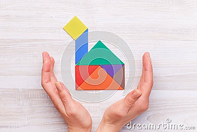 Crop hands with house from colorful blocks Stock Photo
