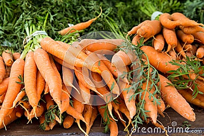 Crop of organically grown carrots on display Stock Photo