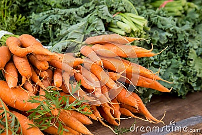 Crop of organically grown carrots on display Stock Photo