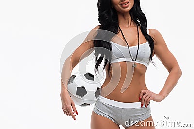 Crop woman in underwear holding soccer ball Stock Photo