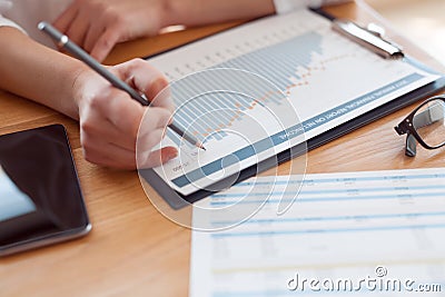 Crop woman working with documents Stock Photo