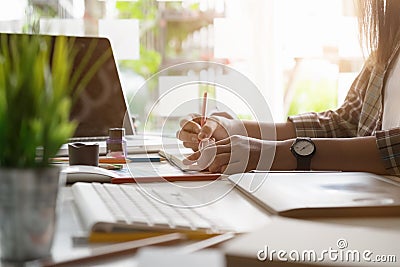 woman artist drawing something on at the creative office. Stock Photo