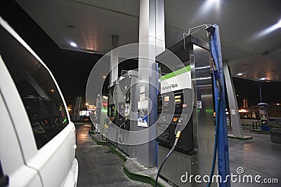 Cropped Car With View Of Fuel Pumps And Natural Gas Stock Photo