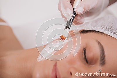 Lovely young woman visiting cosmetologist at beauty clinic Stock Photo