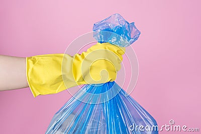 Cropped close up photo of hand holding full garbage bag isolated background Stock Photo