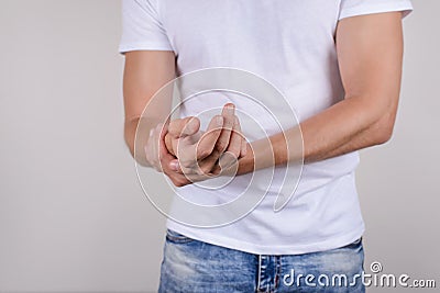 Cropped close up photo portrait of unhappy sad upset stressed unsatisfied guy holding palm in hand isolated on grey background wea Stock Photo