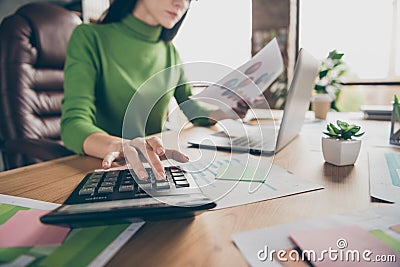 Cropped closeup photo of busy business lady notebook table hold paper stats calculating numbers sums money income sit Stock Photo