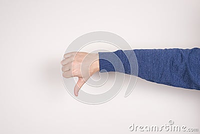 Cropped closeup photo image picture of unhappy sad upset unsatisfied guy giving making finger down gesture isolated grey Stock Photo