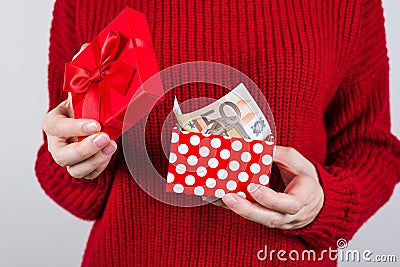 Cropped closeup photo of lucky leader successful student getting big money from little box grey background Stock Photo