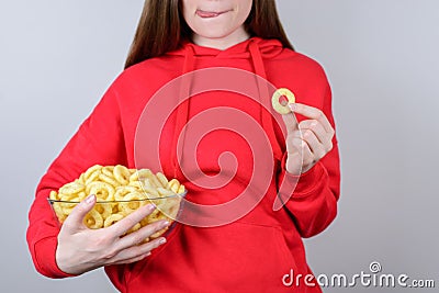 Cropped closeup view photo portrait of funky cool cute teenager youngster looking want tasty rice corn ring licking lips isolated Stock Photo