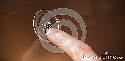 Cropped finger pressing car start button Stock Photo