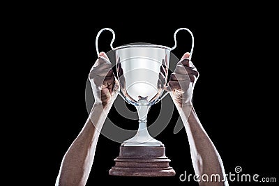 Cropped hand of athlete holding trophy Stock Photo