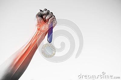 Cropped hand of sportsperson holding gold medal Stock Photo
