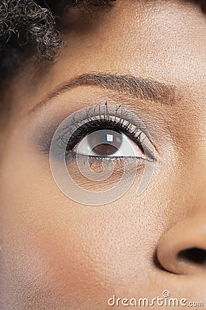 Cropped image of African American woman with eye makeup Stock Photo